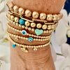 3mm Bead Stretch Bracelet with Matching Eye, CZ Bezel, and Turquoise Charms