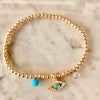 3mm Bead Stretch Bracelet with Matching Eye, CZ Bezel, and Turquoise Charms
