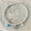 3mm Bead Stretch Bracelet with Matching Eye, CZ Bezel, and Turquoise Charms